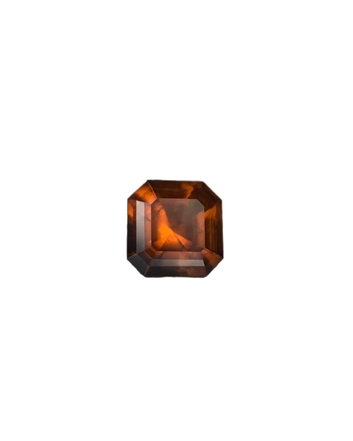 Octagonal brown gemstone on a dark gray background