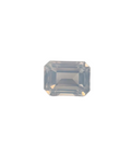 Emerald cut lavender quartz gemstone on a stand with measurement scale
