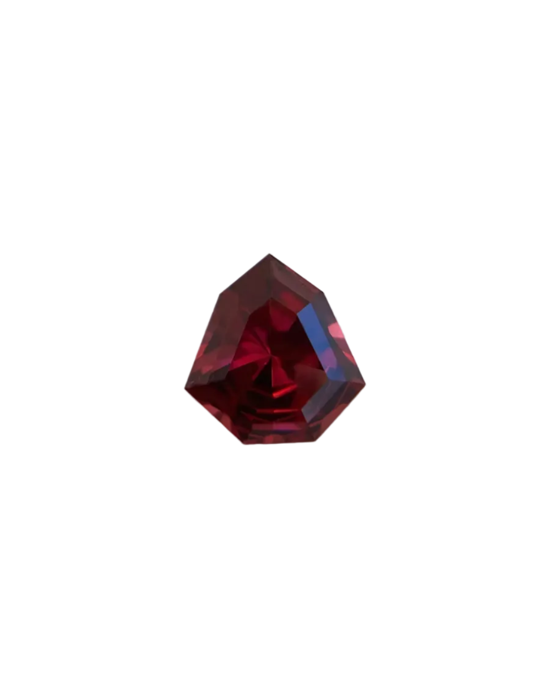 Faceted red gemstone on a light gray background