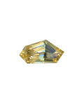 Faceted yellow gemstone on a textured gray background