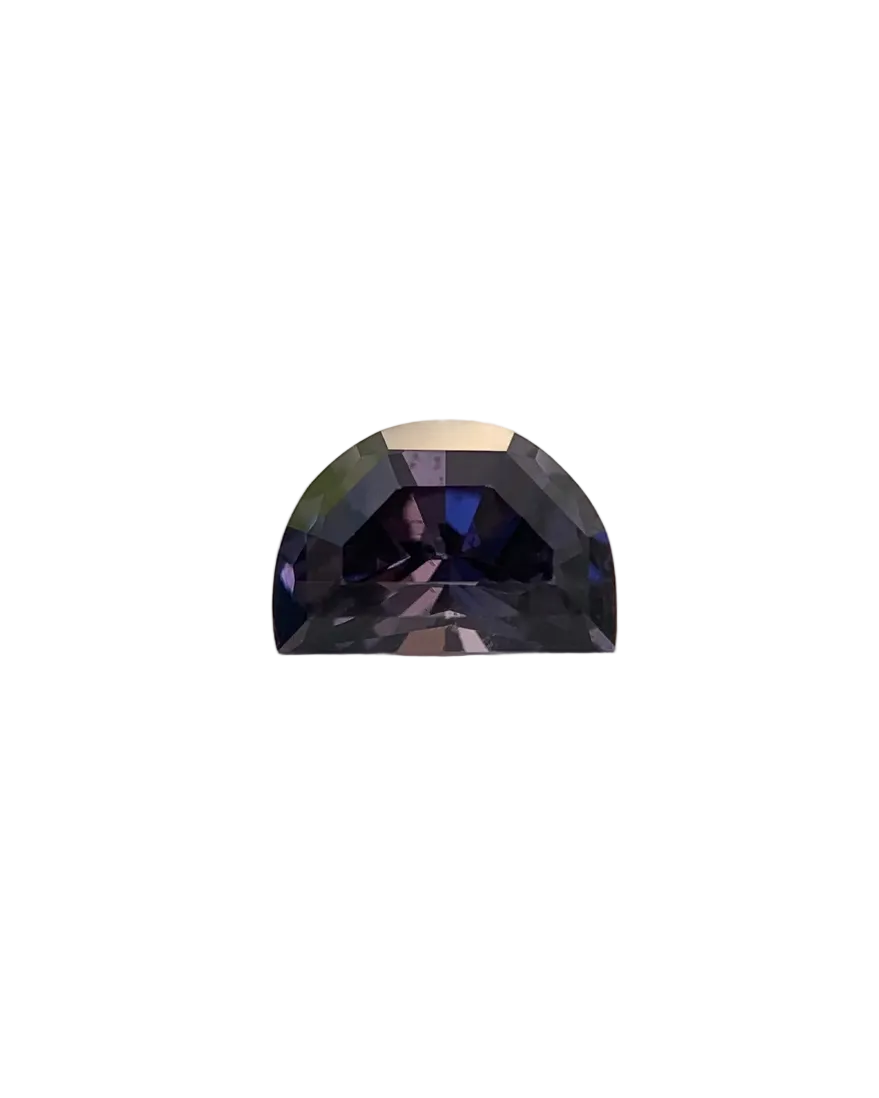 Faceted purple gemstone on a neutral background