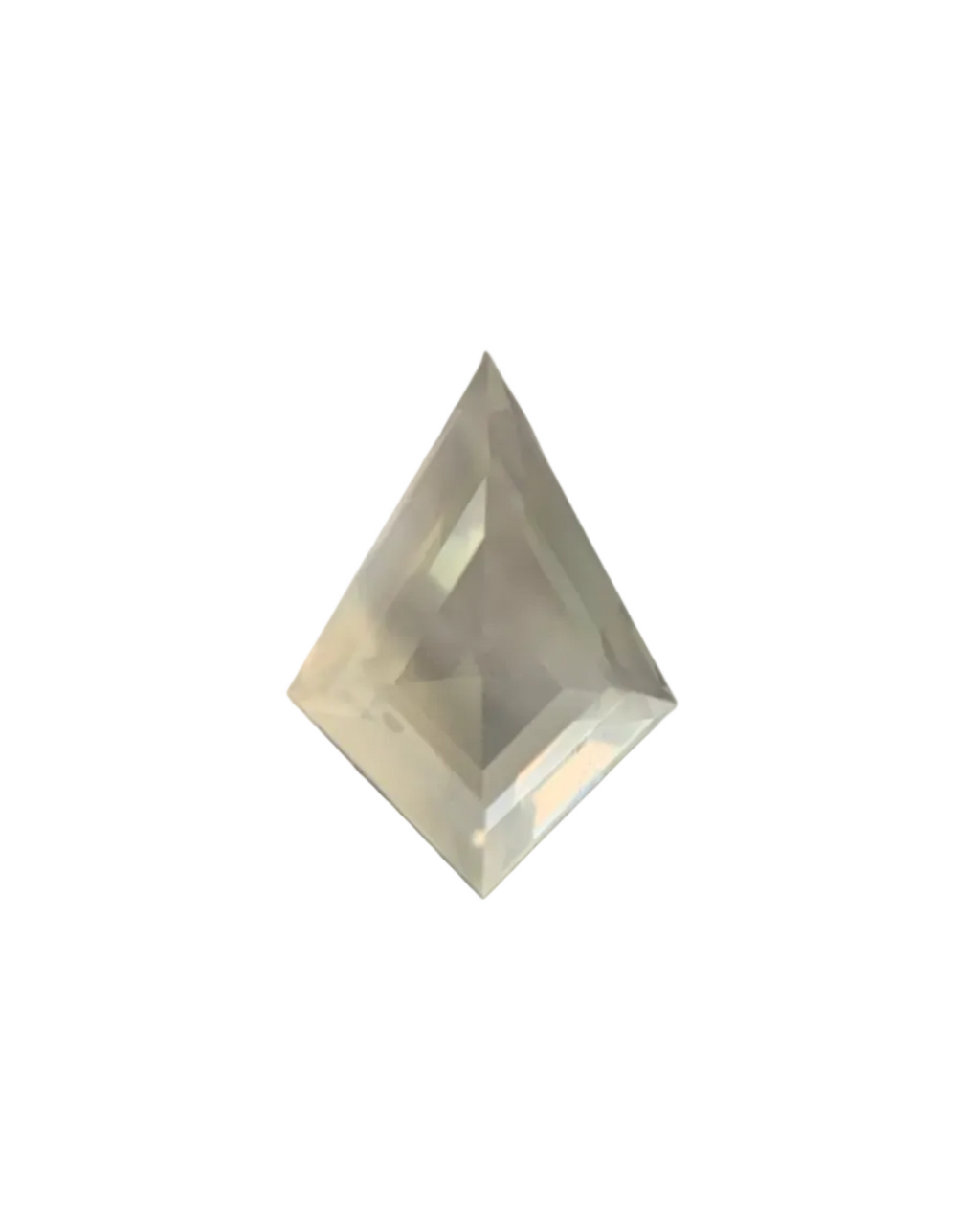 Clear crystal pyramid on a textured surface with a blurred background