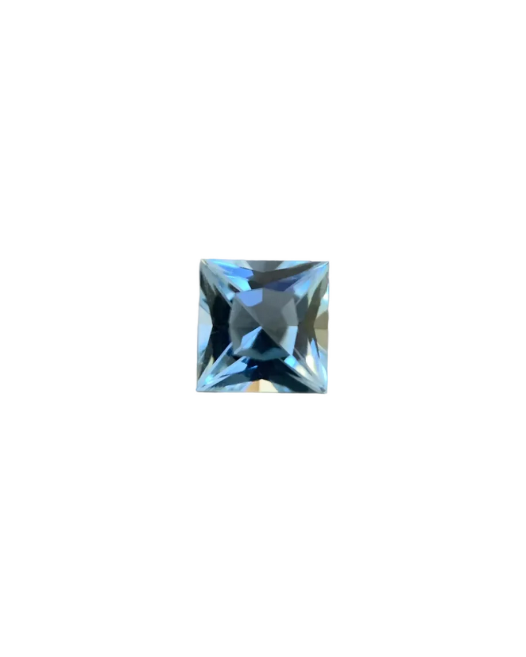 Square-cut blue gemstone on a gray background