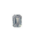 Rectangular cut gemstone on a textured surface