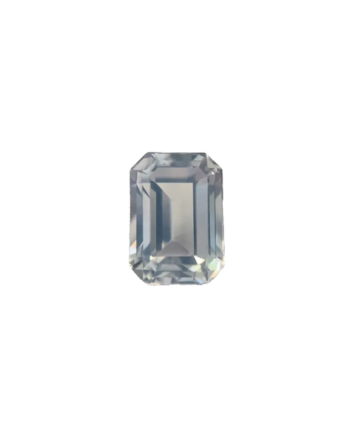 Rectangular cut gemstone on a textured surface