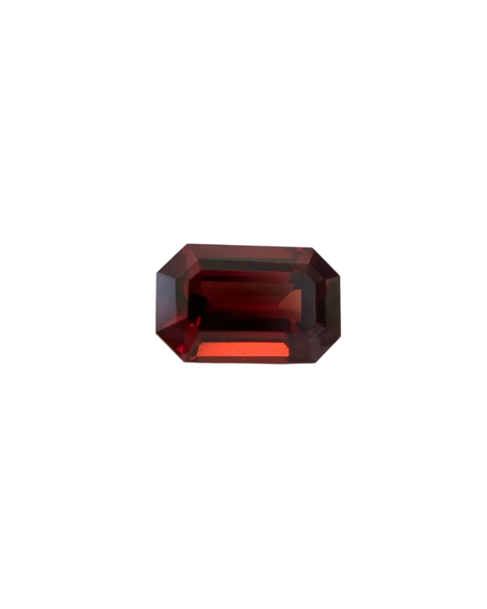 Faceted red gemstone on a white background