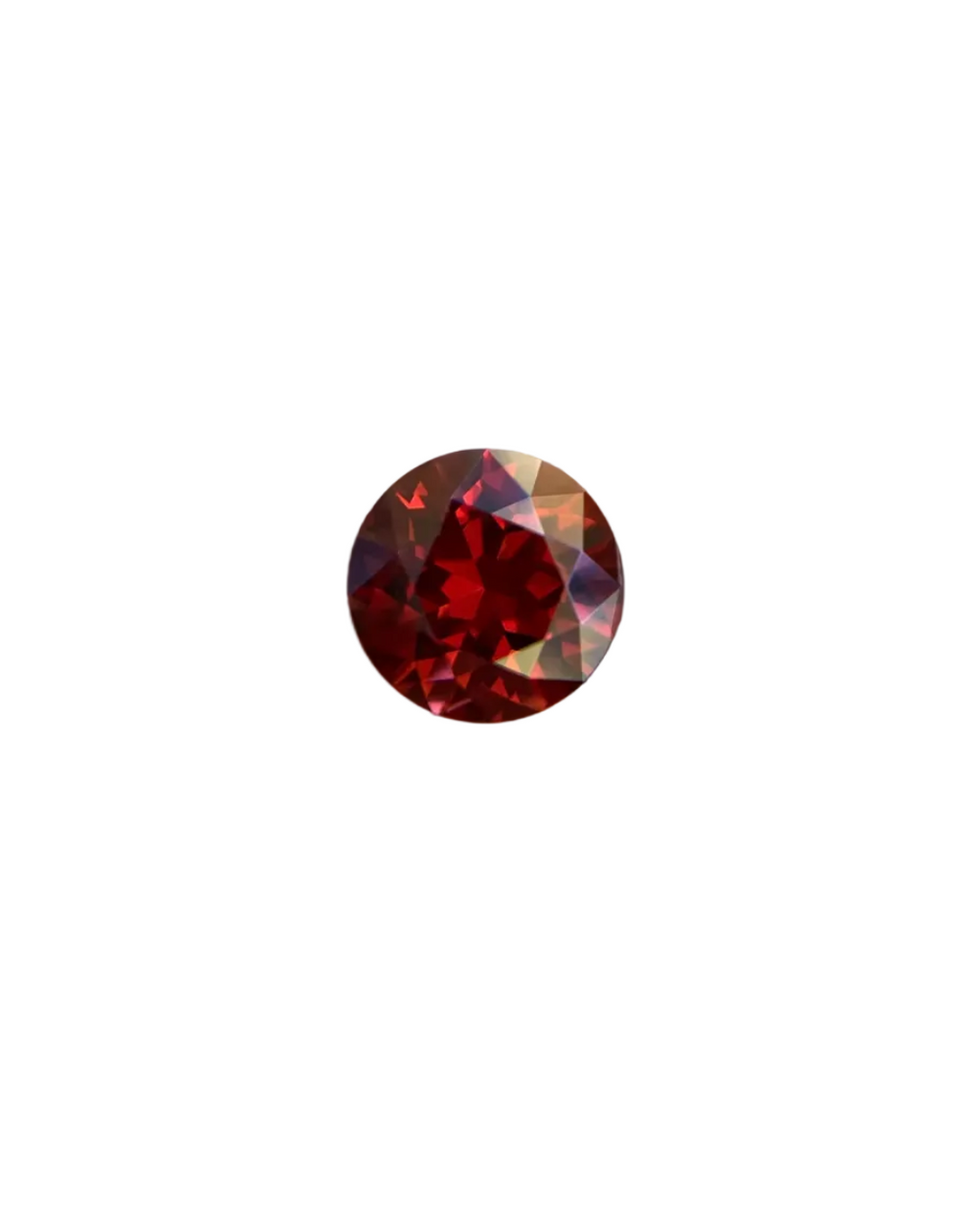 Round red gemstone on a wooden background
