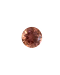 Round pinkish-brown gemstone on a light background